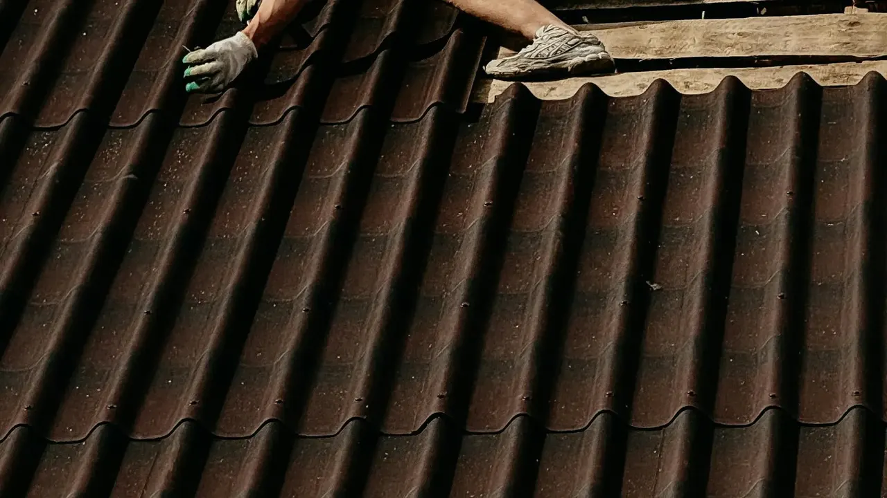 Roofer repairing a pitched roof